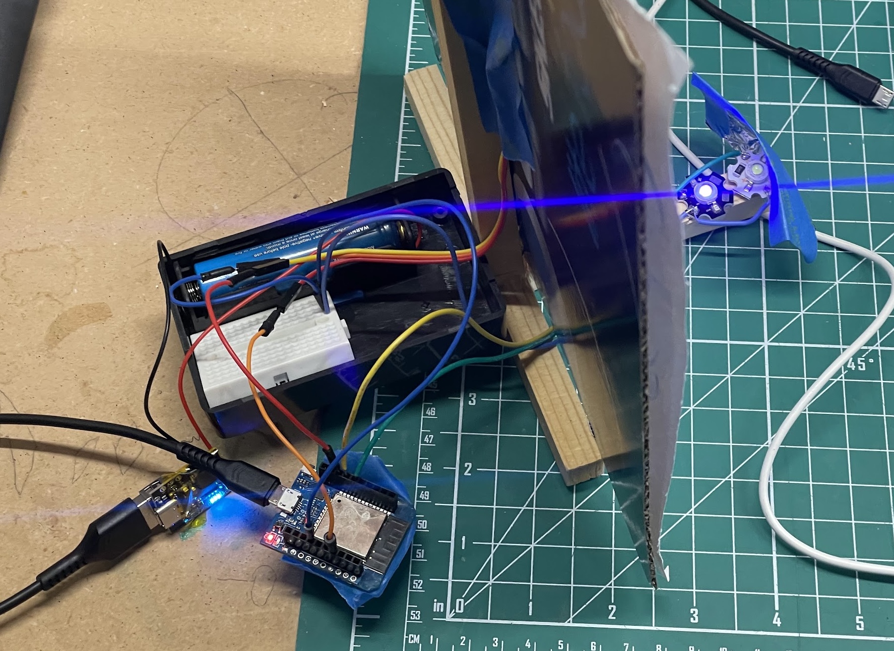 Back and front of the target prototype. Pictured is an 18650 battery connected to a TP4056 li-ion protection circuit, which is powering a D1 Mini ESP32 board via USB.